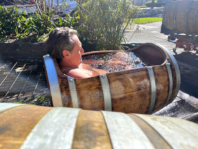 Person in Wine barrel ice bath