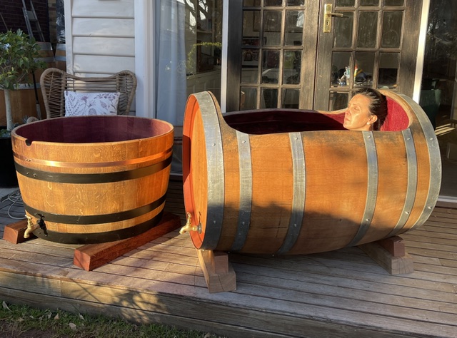 Lady enjoying a relaxing barrel bath