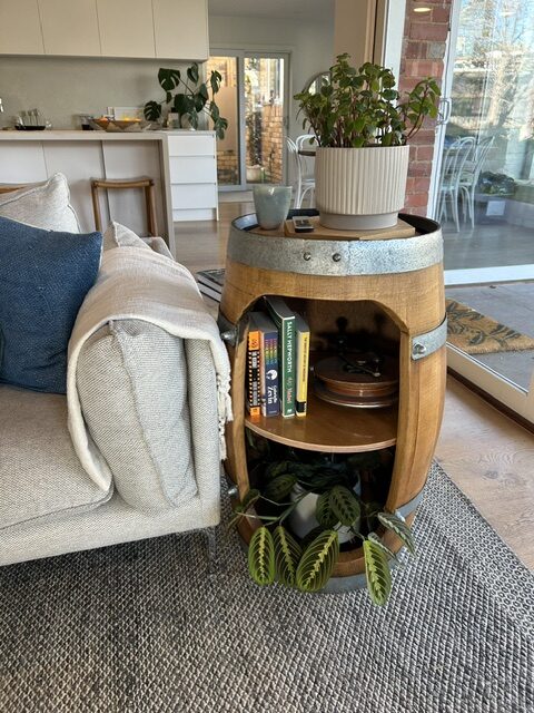Barrel cabinet styled as a living room side table